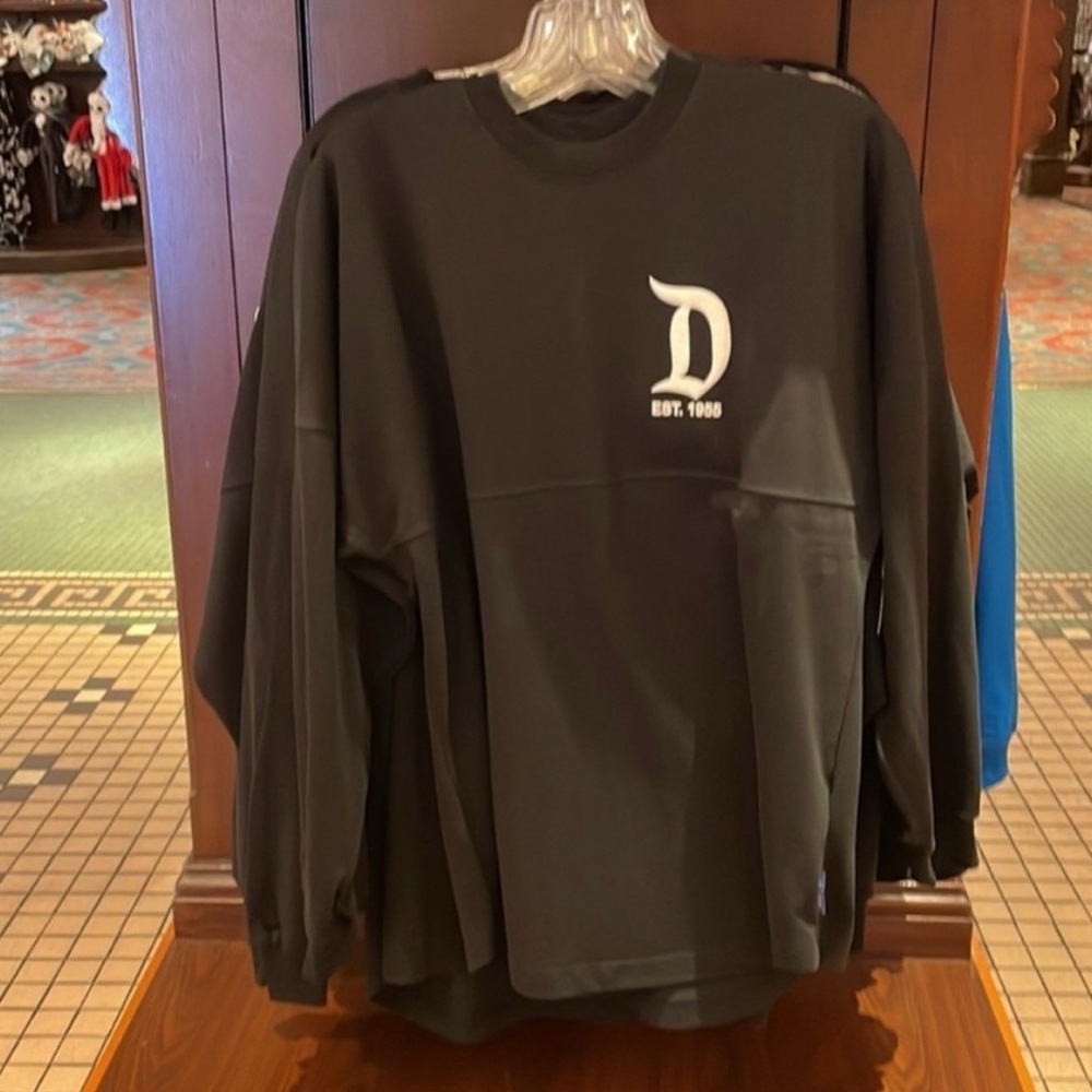 Black with white lettering disney spirit jersey size xs, brand new